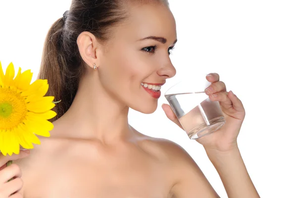Woman drinks water from a transparent glass — Stock Photo, Image
