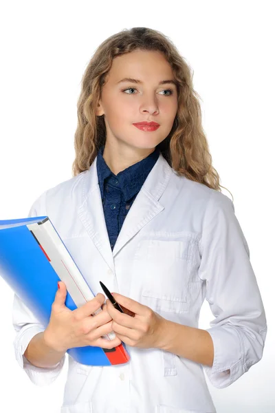 Female medical doctor in a white coat with a blue folder in her — Stock Photo, Image