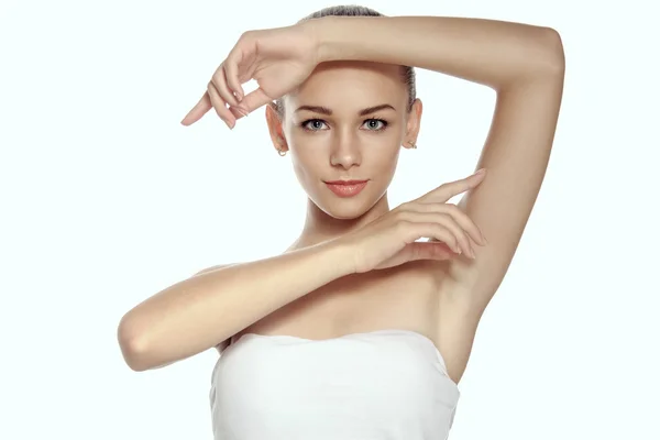 Girl raised her hands up and shows groomed armpits. — Stock Photo, Image