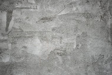 Kaba gri dekoratif alçı. Eski beton duvarın arka planı. Gri grunge dokusu. Çimento dokusu. İç veya dış tasarım için kaplama dokusu. Monolitik alçı dekoratif arkaplan 