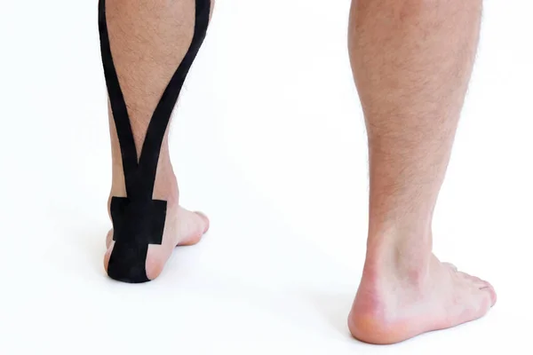 Kinesiology Taping Treatment Black Tape Male Patient Injured Achilles Tendon — Stock Photo, Image