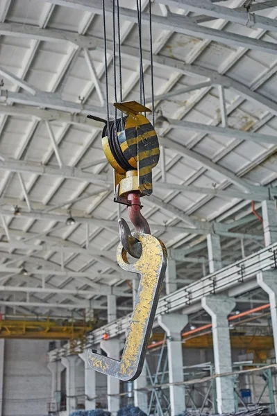 Close up of a yellow factory crane hook — Stock Photo, Image