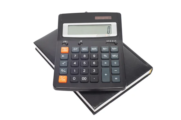 Calculator with black notepad on a white background — Stock Photo, Image