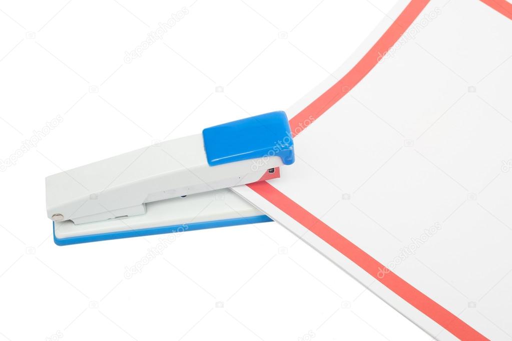 stapler with paper lies on a white background