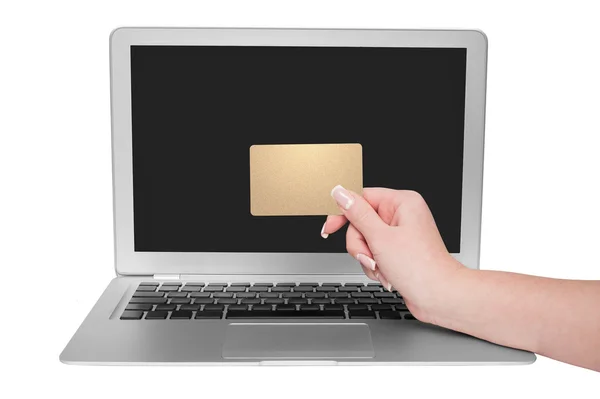 Woman holding gold credit card in hand — Stock Photo, Image