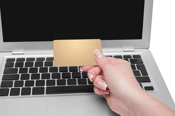 Woman holding gold credit card in hand — Stock Photo, Image