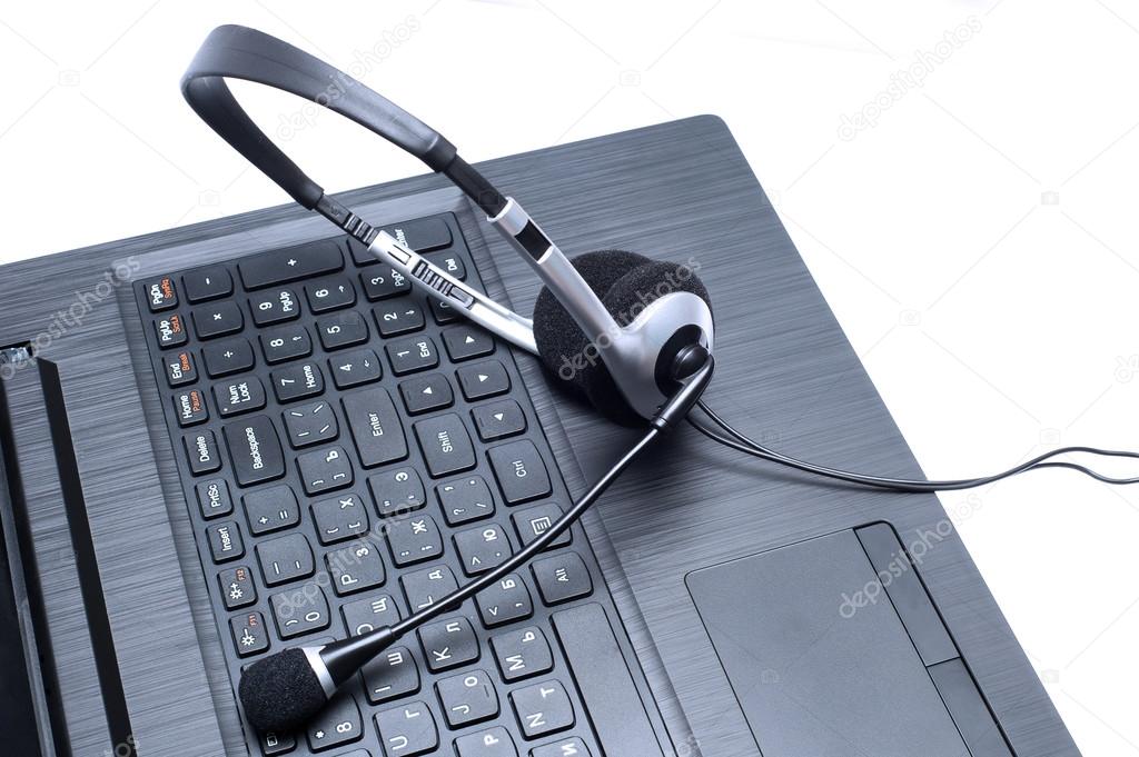Headset lying on a laptop computer keyboard