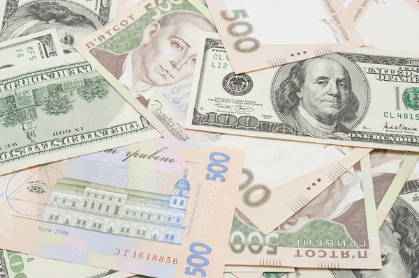 The many dollars and ukrainian money. money background — Stock Photo, Image
