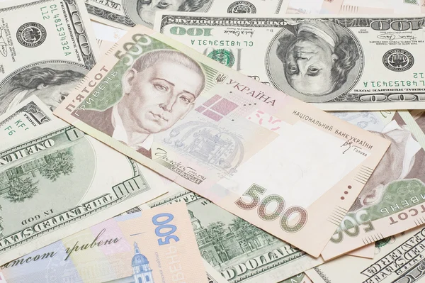The many dollars and ukrainian money. money background — Stock Photo, Image