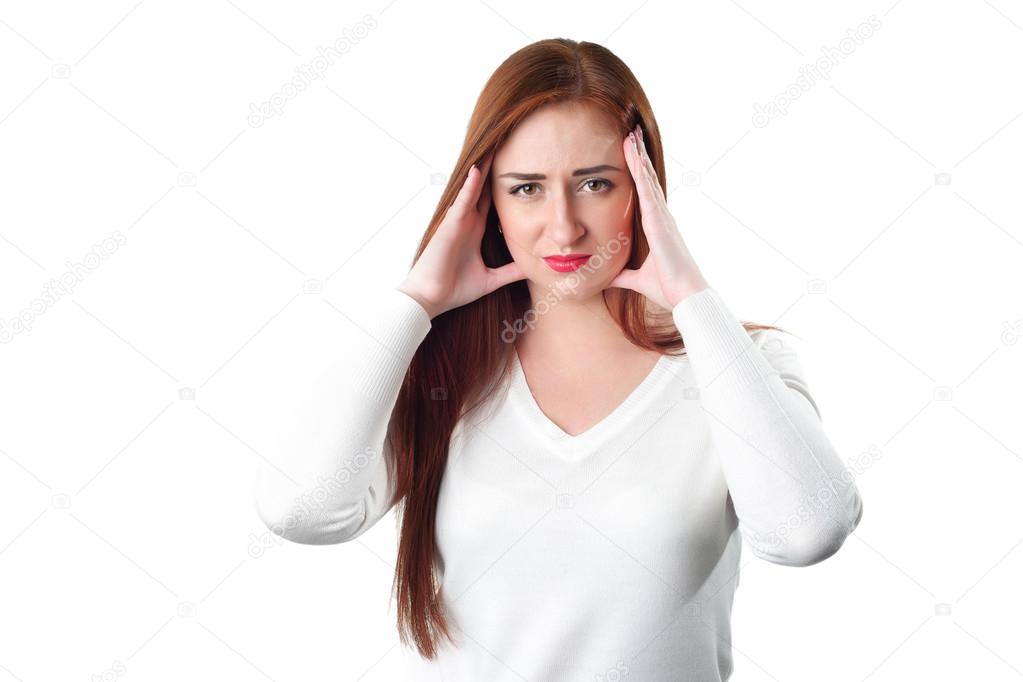 Young redhead woman with headache holding her hand to the head
