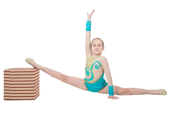 Cute young girl doing gymnastics with cube — Stock Photo, Image