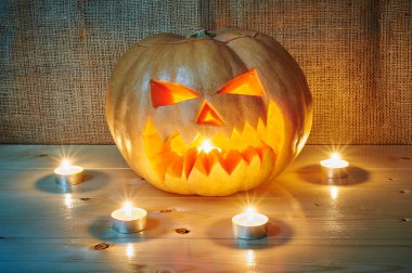 Halloween orange pumpkin jack lantern with candles