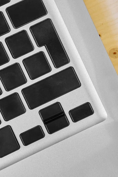 Keyboard buttons on silver laptop — Stock Photo, Image