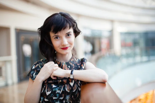 Young woman with red lipstick watching ahead — Stock Photo, Image