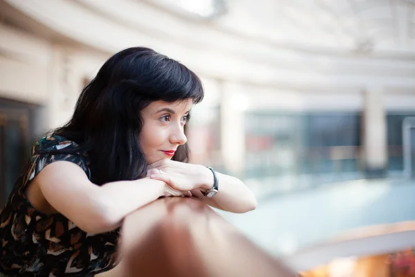 Young woman with red lipstick watching ahead — Stock Photo, Image