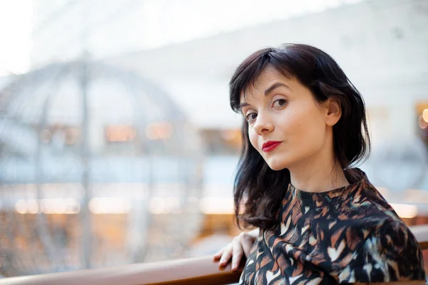 Young woman with red lipstick watching ahead — Stock Photo, Image