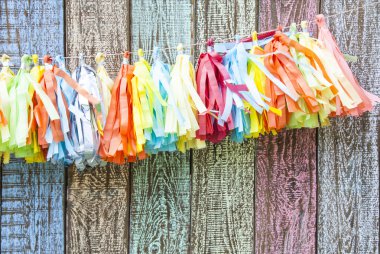 bright colorful paper garland on the fence