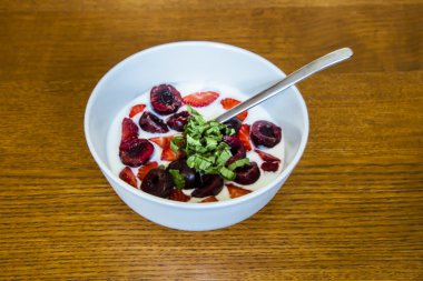 healthy yogurt with cherries and strawberry