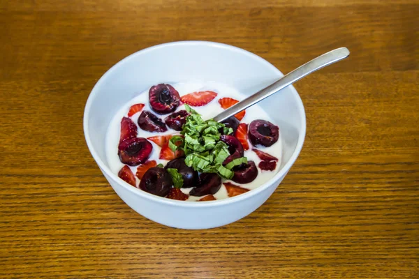 healthy yogurt with cherries and strawberry