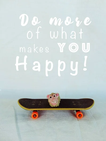 Do more of what makes you happy - Text with skate and sheep