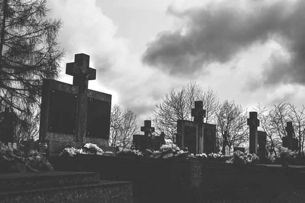 Gravestones on the cemetery.Clouds in background.High quality photo. — Stock Photo, Image