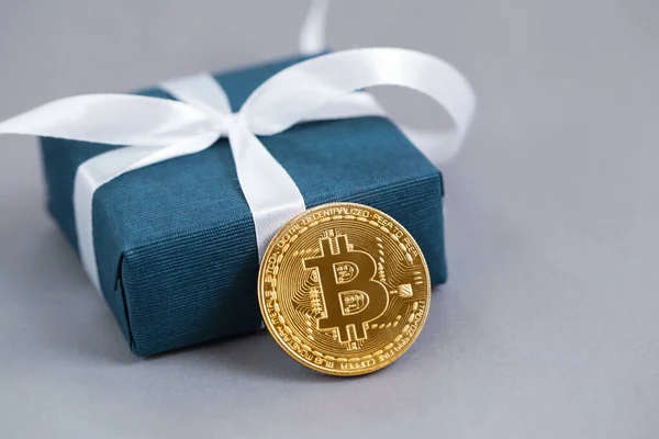 Gift box blue color, cryptocurrency, gold bitcoin on grey background. Gift for men concept. — Stock Photo, Image