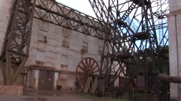 Industrial metal constructions near industrial buildings — Stock Video