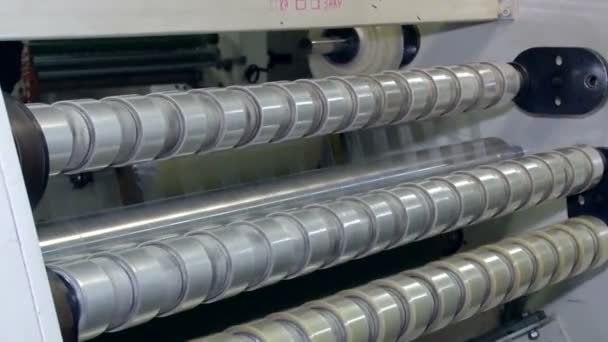 Winding tape with adhesive application rolls — Stock Video