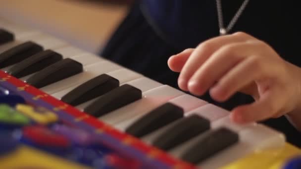 Hand of a child playing keys — Stock Video