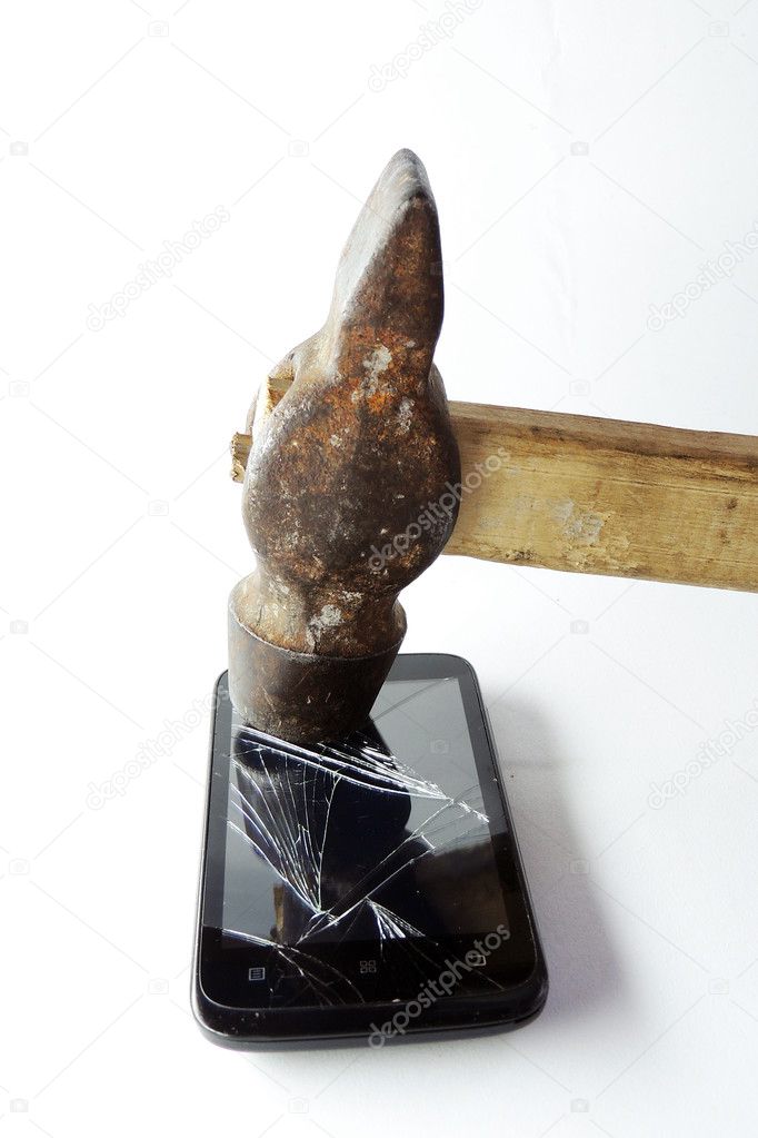 Broken phone screen and hammer 