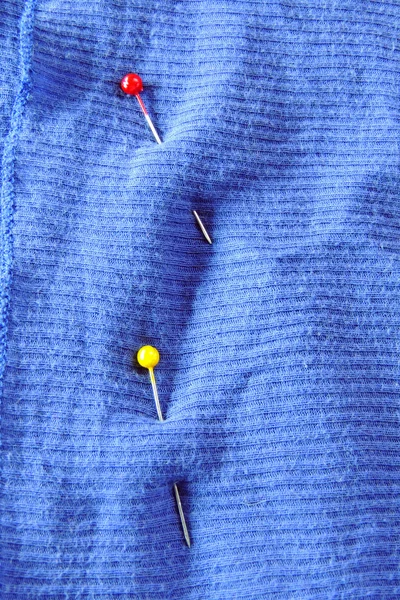 Safety pins on fabric