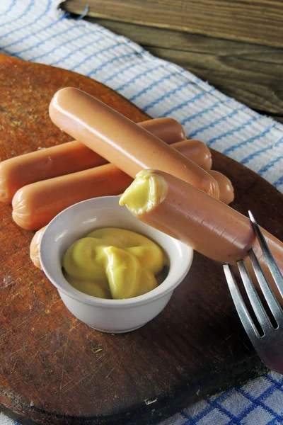 Sausages and mustard sauce — Stock Photo, Image