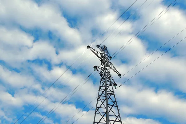 detail of a power line front of blue sky in sunny ambiance