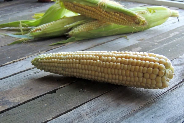 Corn on wooden background — Stock Photo, Image