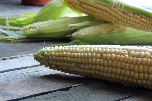 Corn on wooden background — Stock Photo, Image