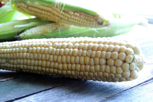 Corn on wooden background — Stock Photo, Image