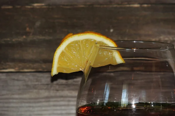 Cognac in a glass of lemon — Stock Photo, Image