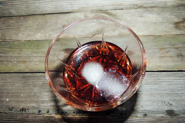 Whiskey with ice in glass — Stock Photo, Image