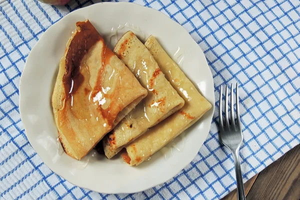 Pancakes with honey — Stock Photo, Image