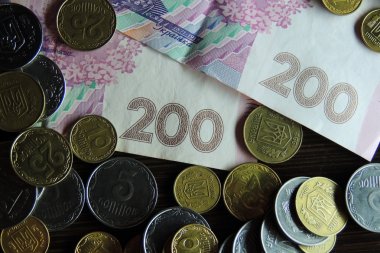 dinero ucraniano y huchaUkraynalı para arka plan