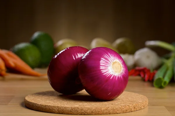 Red onion bulb on the wooden background — Stock Photo, Image
