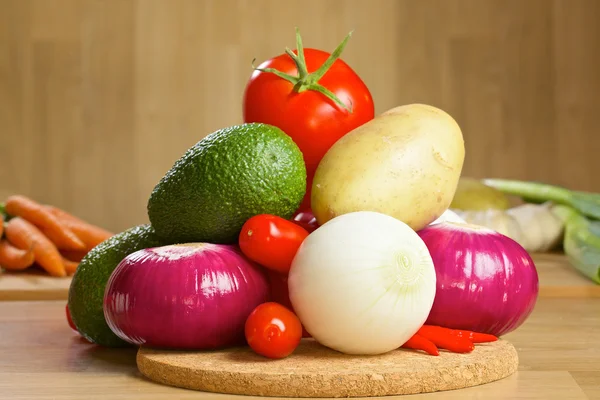 Bunch of fresh vegetables on a wooden board