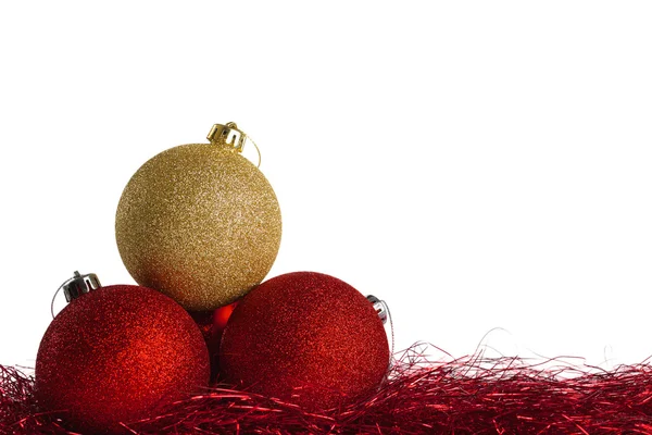 Red and yellow christmas balls with tinsel — Stock Photo, Image