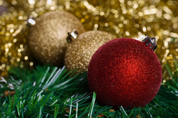 Christmas balls with yellow tinsel — Stock Photo, Image