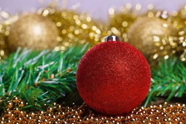 Christmas balls with yellow tinsel — Stock Photo, Image