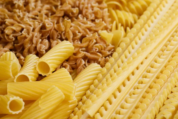 Different types and shapes of Italian pasta — Stock Photo, Image