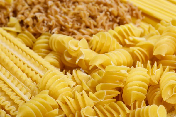 Different types and shapes of Italian pasta — Stock Photo, Image