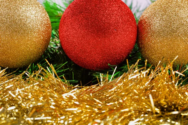 Christmas balls on green fir-tree branches — Stock Photo, Image