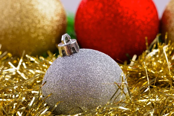 Christmas balls on green fir-tree branches — Stock Photo, Image