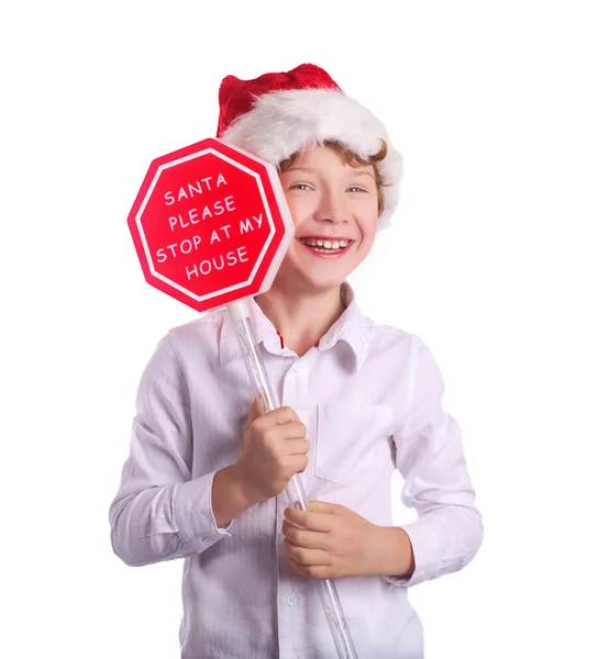 Boy holding christmas sign asking Santa to come by. Isolated on white background — Stock Photo, Image